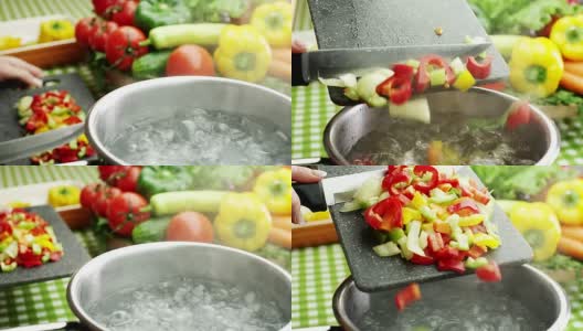 女人在热水中加入切碎的蔬菜高清在线视频素材下载