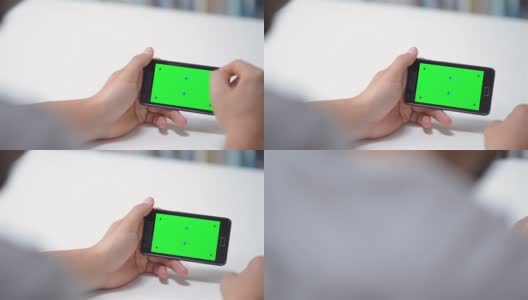 摄影:智能手机上的绿色屏幕高清在线视频素材下载