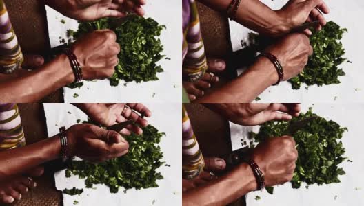 印度妇女以传统方式切蔬菜高清在线视频素材下载