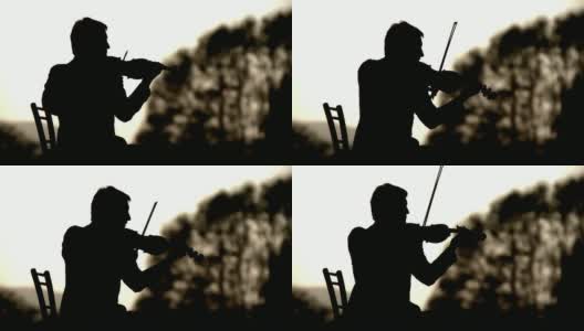 一个小提琴家的剪影高清在线视频素材下载
