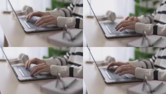 一个女人在笔记本电脑上打字的特写高清在线视频素材下载