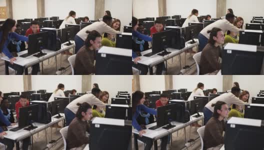 年轻的多种族学生在学校教室里使用电脑高清在线视频素材下载