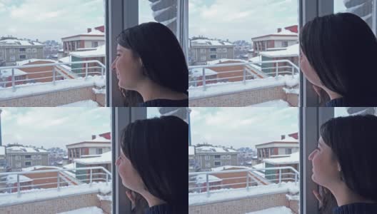 一个快乐的女人看着雪景的特写高清在线视频素材下载