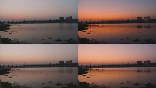 从白天到晚上，萨巴尔马蒂河和桥的时间推移，在河边，艾哈迈达巴德城市在黄昏。美丽发达的城市，印度古吉拉特邦。高清在线视频素材下载