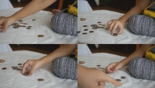 小女孩的手在数硬币高清在线视频素材下载