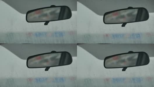 汽车后视镜和挡风玻璃上的雨滴高清在线视频素材下载