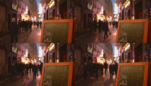 巴黎拉丁区，人们走在舒适的狭窄街道上，街上有咖啡馆餐厅高清在线视频素材下载