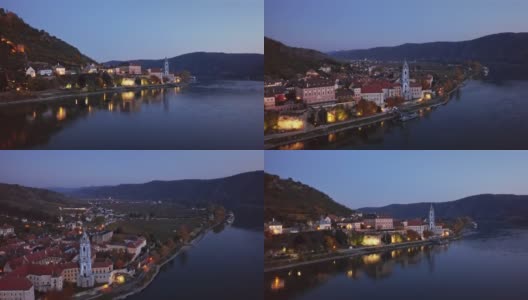 邓恩斯坦镇和葡萄园的夜间空中全景图。奥地利Wachau山谷，从24帧加速到2.5倍。高清在线视频素材下载