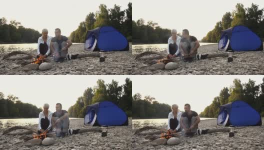 高清多莉:夫妇露营在河边高清在线视频素材下载