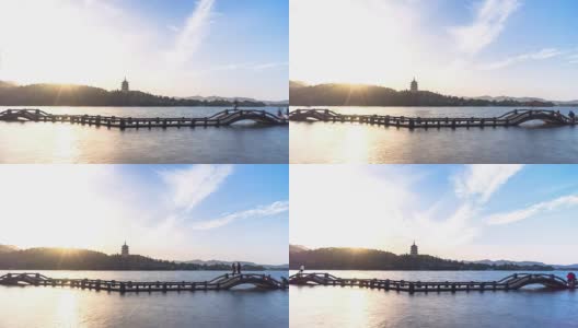 西湖之桥，蓝天之塔之山。4 k高清在线视频素材下载
