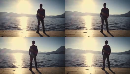 日落时分，一个人站在湖边高清在线视频素材下载