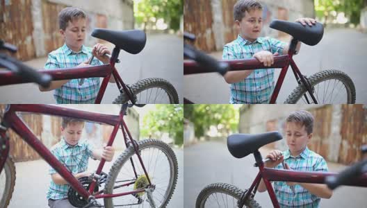小男孩在修自行车高清在线视频素材下载