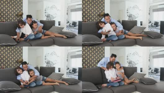 亚裔父亲和孩子一起看电视高清在线视频素材下载