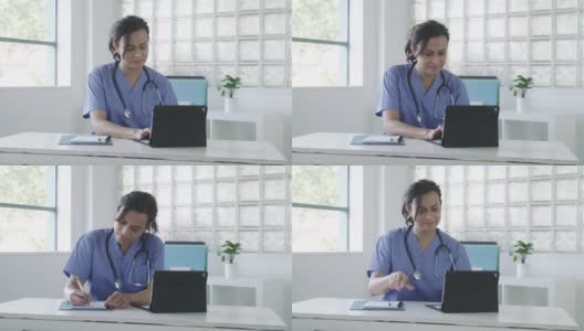 女医生在平板电脑上查看病人记录高清在线视频素材下载
