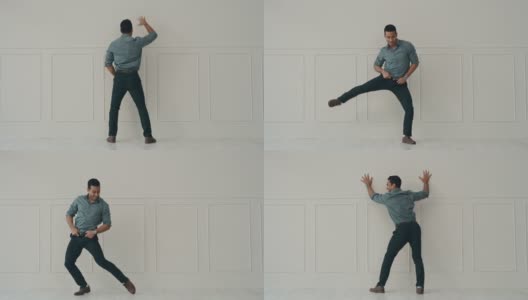 一个年轻英俊的商人独自在办公室跳舞的4k视频高清在线视频素材下载