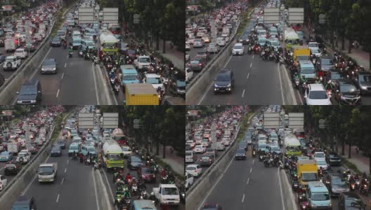 雅加达,印度尼西亚。2017年8月14日:雅加达卡萨布兰卡街上，拥挤的汽车和摩托车在交通堵塞的情况下行驶高清在线视频素材下载
