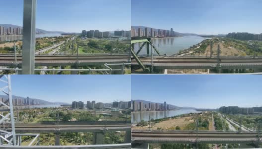 中国福建，高铁穿过城市高架桥，窗外城市风光高清在线视频素材下载