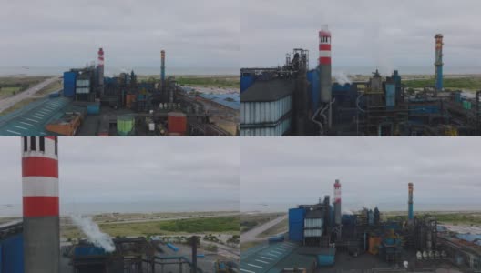 向前飞的生产工厂上面。沿海化工厂的管道和烟囱。南非伊丽莎白港高清在线视频素材下载
