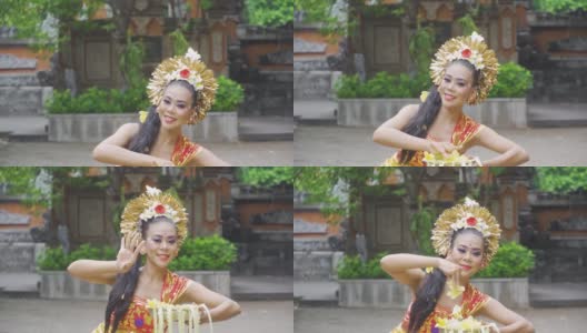 年轻的巴厘岛舞者在庙里表演高清在线视频素材下载