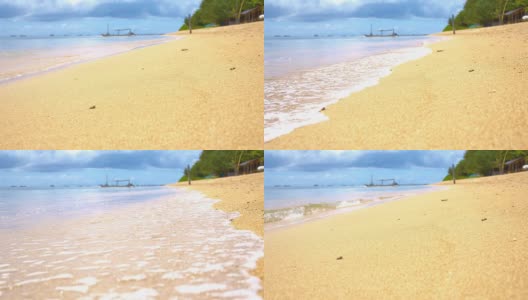 慢动作海浪溅在巴厘岛的沙滩上高清在线视频素材下载