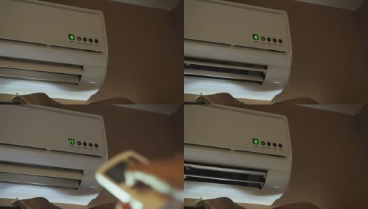 通过遥控器改变空调温度来加热房间高清在线视频素材下载