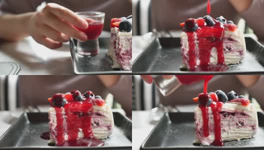 将草莓酱倒在蓝莓芝士蛋糕上高清在线视频素材下载