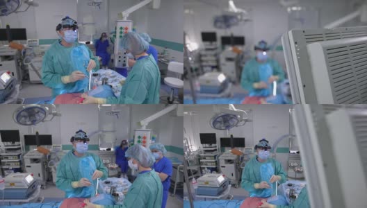 多民族外科合作团队在手术室进行器官移植手术。高清在线视频素材下载