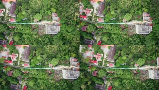 龙像与寺庙和红色神社在热带雨林的山在Wat Ban Tham高清在线视频素材下载