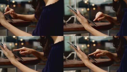 一名亚洲妇女在咖啡馆用平板电脑阅读电子书高清在线视频素材下载