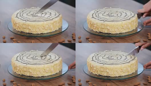 漂亮的Esterh zy蛋糕。女孩厨师把蛋糕切成片高清在线视频素材下载