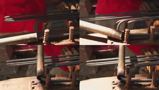 钢铁工人手工弯曲铁棒高清在线视频素材下载