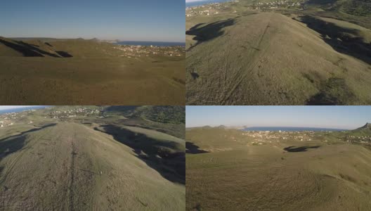 无人机空中飞行日落山谷与丘陵在阳光明媚的一天高清在线视频素材下载