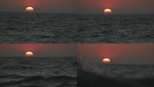 从一艘船的舷窗望去，是平静的日落的海面高清在线视频素材下载