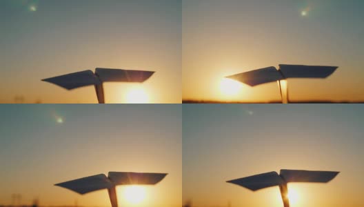 一架纸飞机在阳光下飞行。经营理念的光明开端。观点视频高清在线视频素材下载