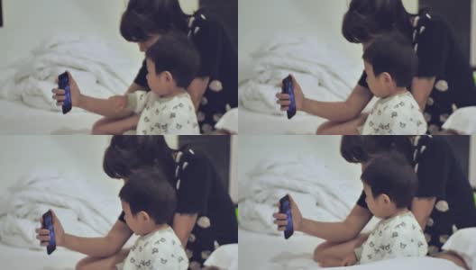 母子用手机视频聊天高清在线视频素材下载