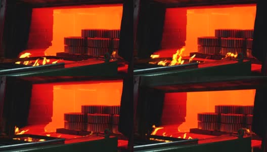 机器零件在炉内高温淬火。大型钢铁厂。金属厂滚高清在线视频素材下载
