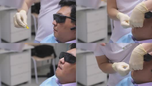 牙科医生手持白手套，将印模材料放入病人口中，为病人做牙模高清在线视频素材下载