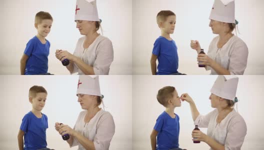 医生给一个小男孩吃药高清在线视频素材下载