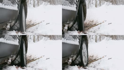 一辆车的转轮陷在雪里了。高清在线视频素材下载