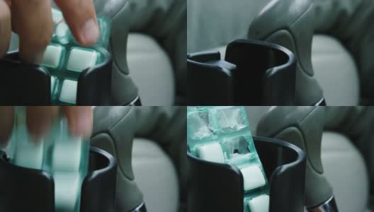 一个白种人的手从一个汽车杯架上拿起一个口香糖泡罩包，然后把它换掉高清在线视频素材下载