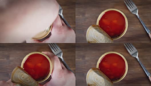 双手打开番茄酱豆罐头。高清在线视频素材下载