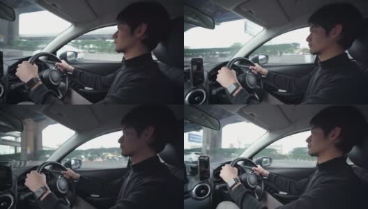 优步司机在他的车里使用智能手机上的GPS高清在线视频素材下载