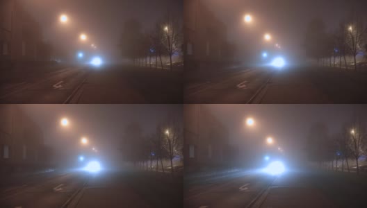 车头灯照亮了车辆行驶的道路。雾蒙蒙的夜晚。高清在线视频素材下载