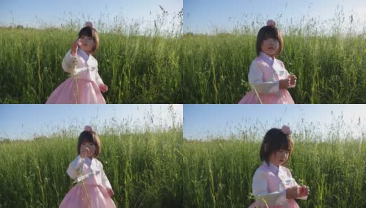 韩国国家儿童粉红服装上站着一个四岁的小女孩高清在线视频素材下载