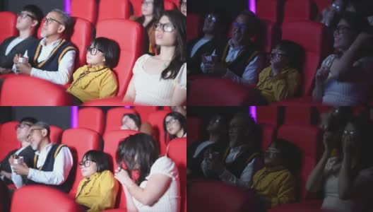 一群中国观众带着3D眼镜在电影院观看3D电影高清在线视频素材下载