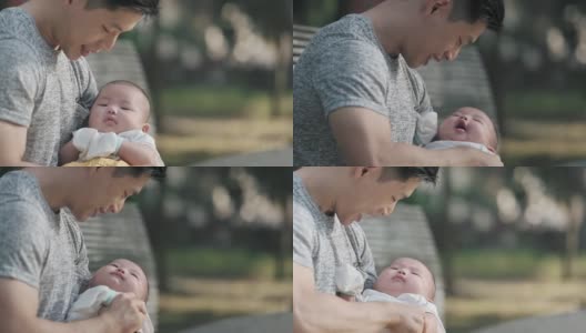 亚裔中国父亲周末早上在公园和他的孩子亲密无间高清在线视频素材下载