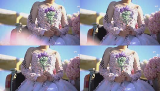 新娘捧着花束在花园里高清在线视频素材下载