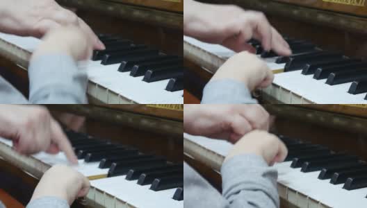 一个小孩和一个老太太在一起弹钢琴的手的特写高清在线视频素材下载