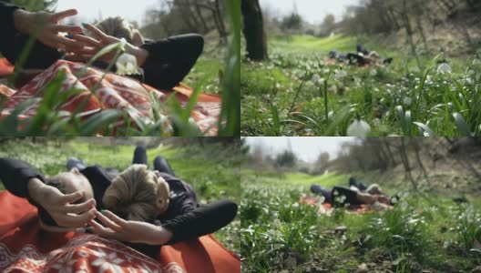 HD STEADY:一对躺在春雪间的情侣高清在线视频素材下载