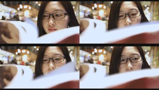 一个女人在图书馆看书高清在线视频素材下载